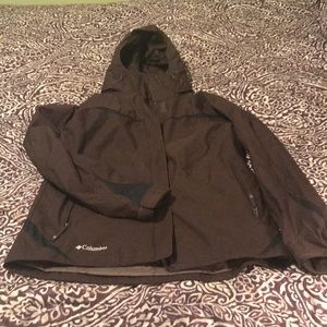 Columbia black and brown hooded rain jacket.